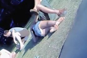 Lying in the park teen gets her jeans upskirt voyeured