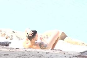 Couple Threesome In A Nudist Beach