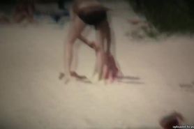 Intriguing, hot redhead in a nude beach video