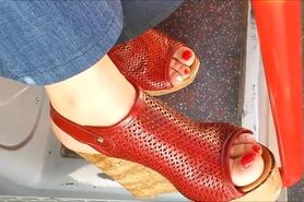candid feet in red sandals
