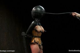 Bound busty slave in latex tormented