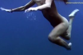 Underwater swimming girls on Tenerife