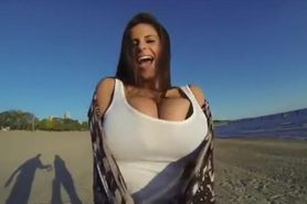 Video shoot with busty girl outdoors