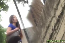 Cute asian teen pissing outdoors