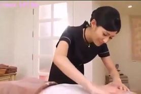 Japanese brunette performs massage and handjob