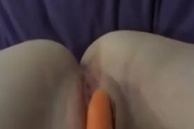 Horny amateur girl masturbates with a carrot