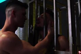 Liam Skye watches Tristan Hunter from a steel cage
