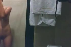 Asian woman secretly filmed in shower