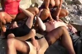 Blondes piss on slave men in kinky outdoor scene