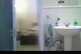 Hidden camera in bathroom catches busty chick
