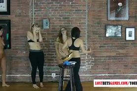 4 Beautiful women play stripping a balancing game