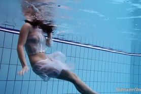 Sexy girl Aneta swims and strips naked