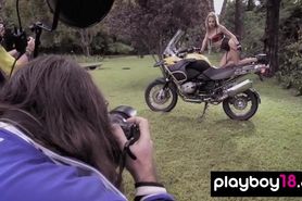 Big boobed naked blondie Danielle Mathers posing on a motorbike outdoor
