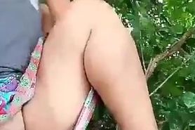 Thai aunty shaved pussy flashing on a tree