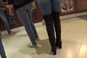 Perfect girl in tight jeans and high boots
