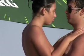Teenage couple kissing on a beach