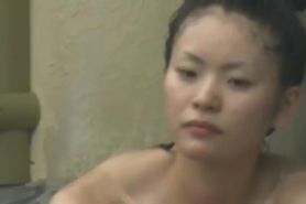 Beautiful Asian woman naked on a SPA