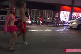 Cheerful women flash beautiful tits in the street