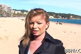 Blonde MILF walks on the beach before sex