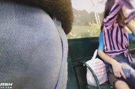 Girl on boyfriend's lap looking bulge