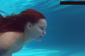 Small teen Mia Ferrari strips naked in pool