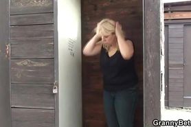 Outdoors screwing for a busty GILF by a young blond man