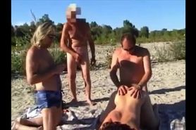 Men fuck mature in front of onlookers on beach