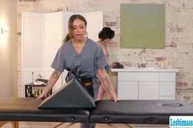 Brunette masseuse gives a finger massage with a bolster