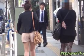 Japanese teens peeing outside