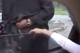 Dogging girl gives handjobs out the car window