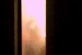 Hot MILF neighbour spied showering through fro ...