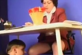 Mature teacher copulates with naughty student on desk