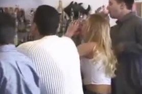 Embarrased chick undressed in crowded bar