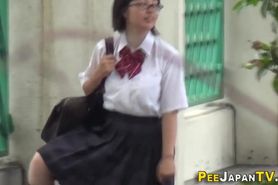 Asian students piss on the street