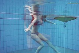 Big boobs teenie Liza Bubarek swimming naked in the pool
