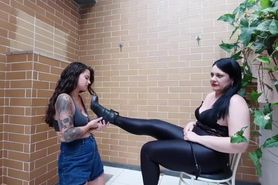 Mature mistress makes young slave girl to lick her boots then tramples her