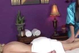 Masseuse tenderly rubbing clients hot body