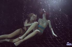 Two girls underwater experience