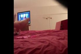 Girl uses dildo watching porn and cums