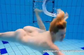 Cute Lucie stripping underwater