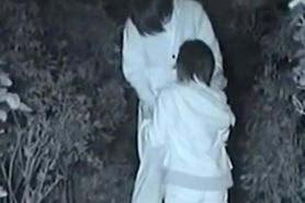 Voyeur films an Asian couple having sex in a park