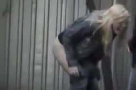 Blonde and brunette girls caught peeing outdoors