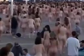 Hundreds of people strip nude to pose for a picture