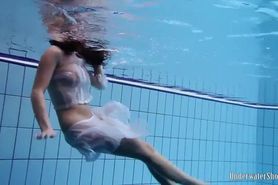 Sexy girl Aneta swims and strips naked
