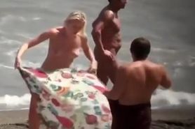 Nudist blonde woman caught in nudist beach