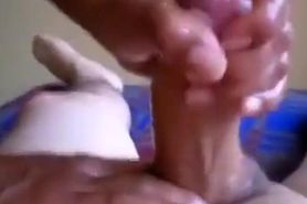 Massage table handjob from a woman with a good grip
