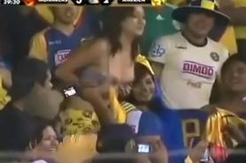 Sexy soccer fan flashes fans by accident