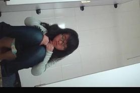 Japanese woman in glasses caught pissing
