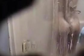 Spy shower cam gets mature girl showering