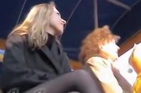 Public upskirt of the blonde with crossed legs in stockings
